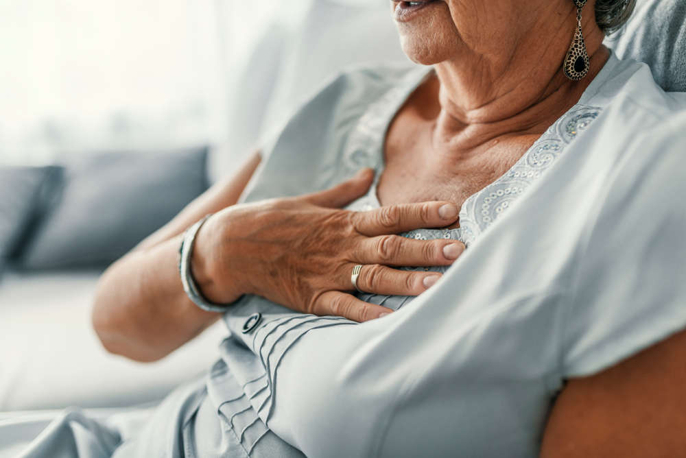 Senior woman suffering from heartburn