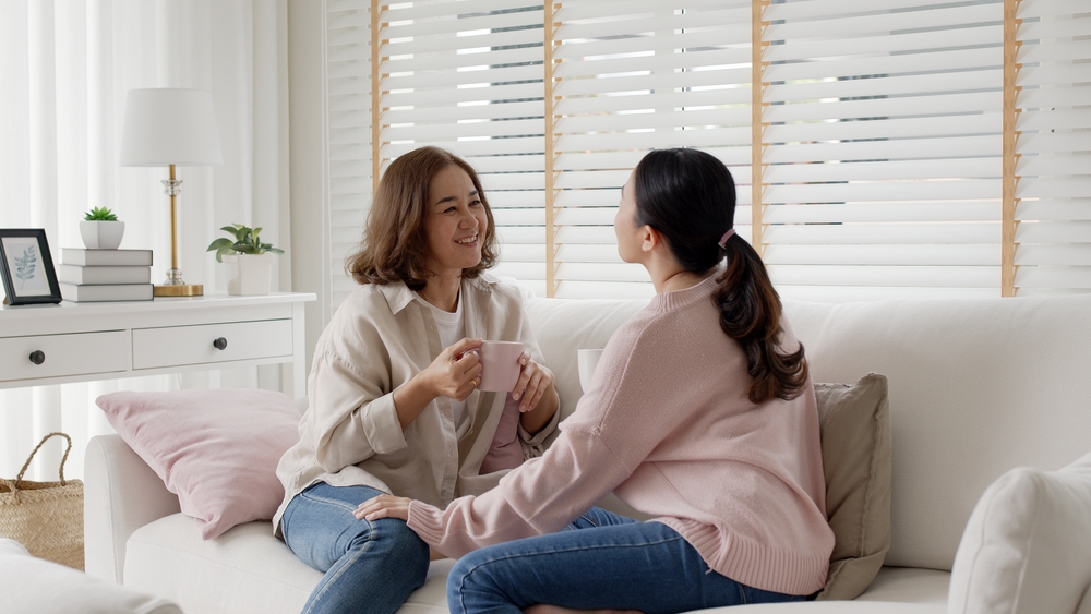 Woman discussing weight loss surgery with family.