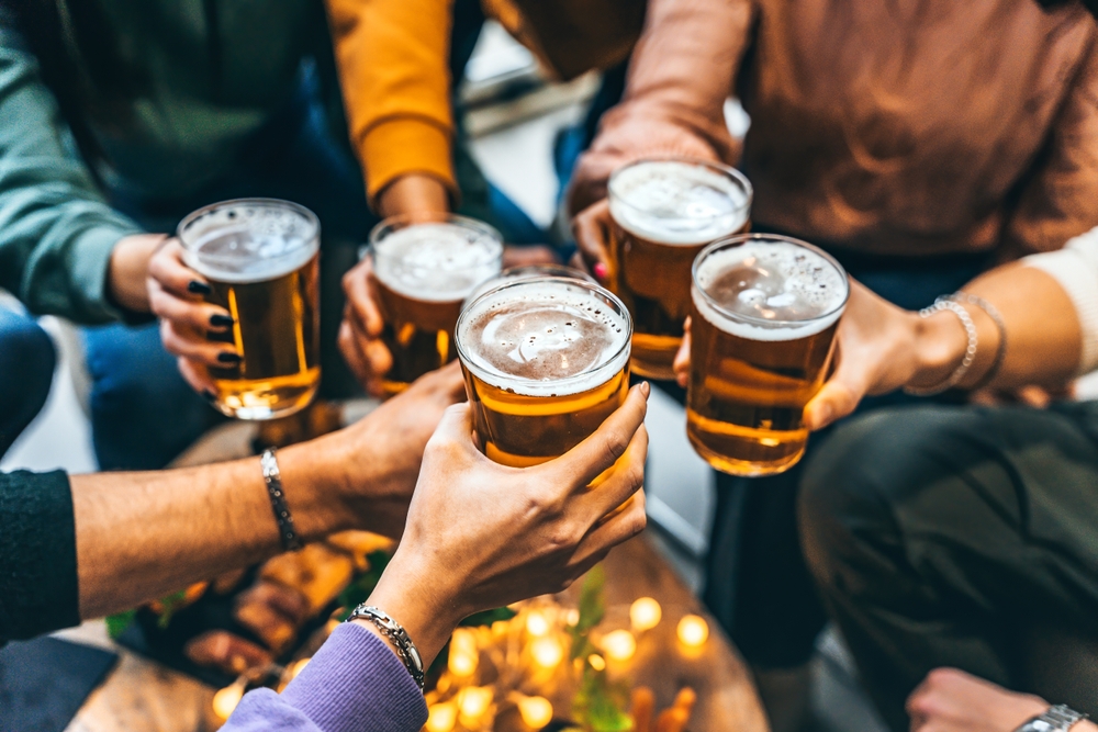 friends cheersing beer.