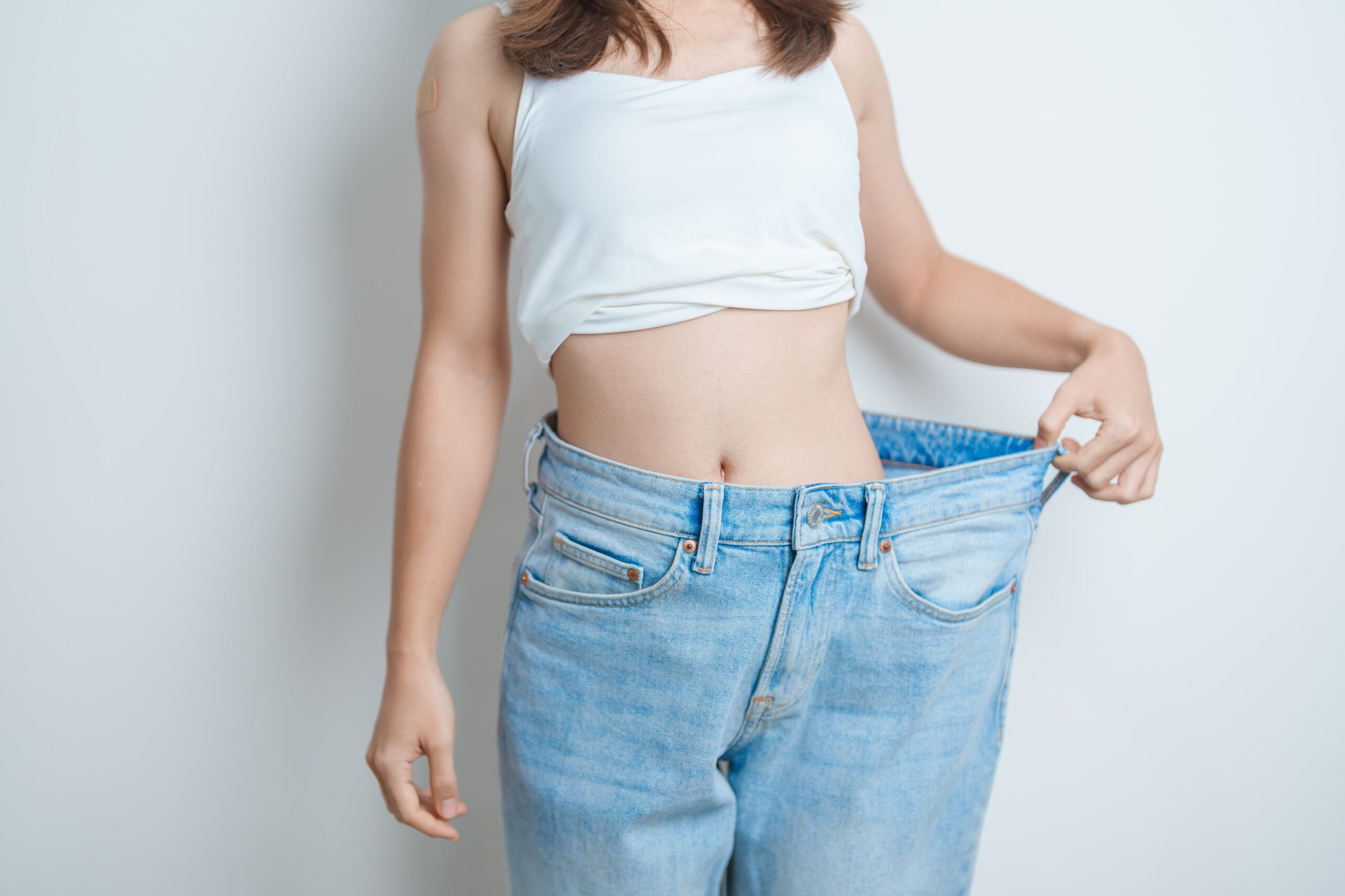 Woman showing off weight loss